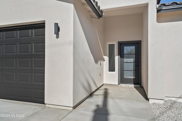 property entrance featuring a garage