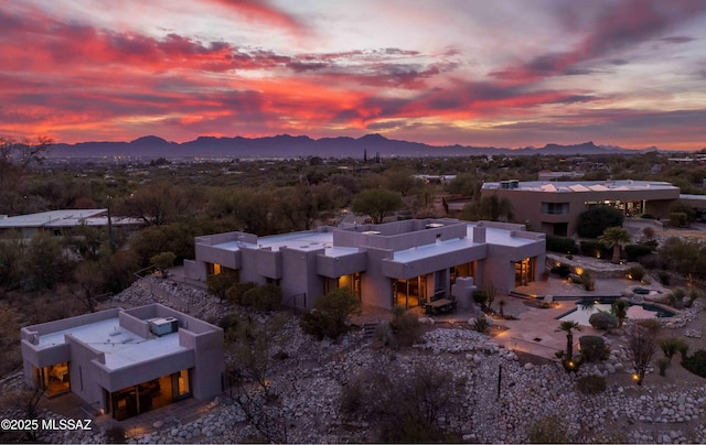 aerial view at dusk with a mountain view