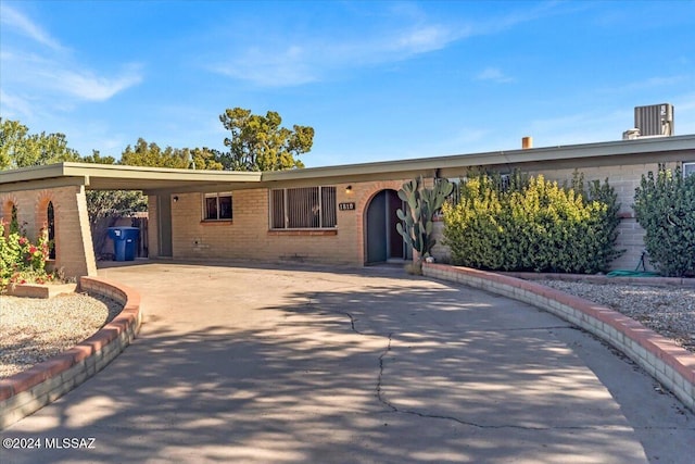 view of front of property with a carport