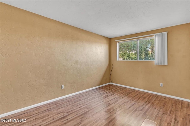 empty room featuring hardwood / wood-style floors