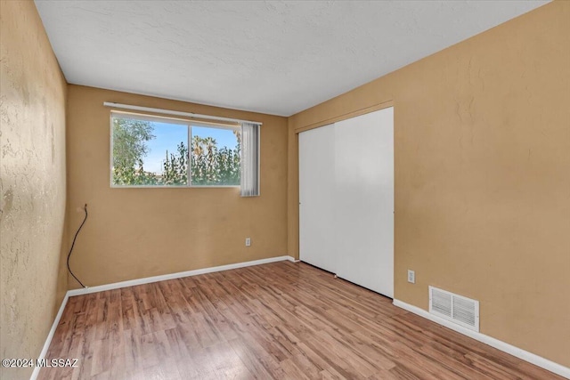 spare room featuring light hardwood / wood-style flooring