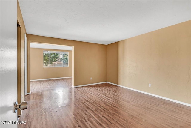 spare room featuring hardwood / wood-style floors