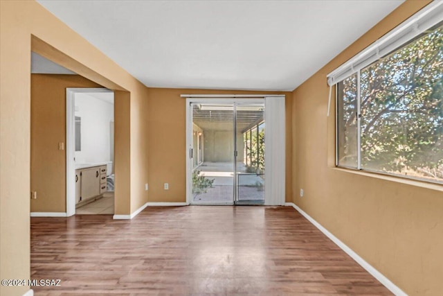 spare room featuring hardwood / wood-style flooring