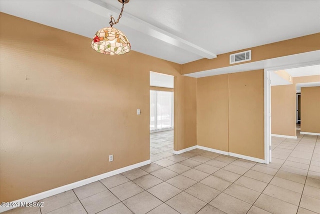 tiled empty room with beam ceiling