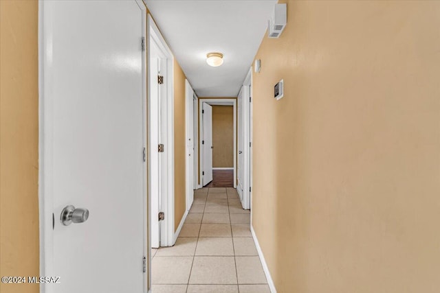 hallway featuring light tile patterned flooring