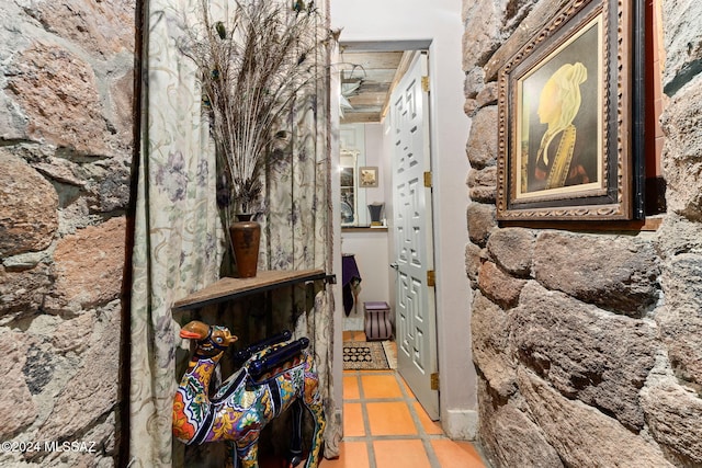 hallway with light tile patterned floors