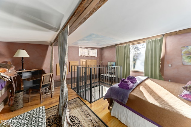 bedroom featuring light wood-type flooring and multiple windows