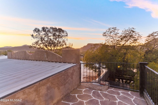 patio terrace at dusk with a mountain view