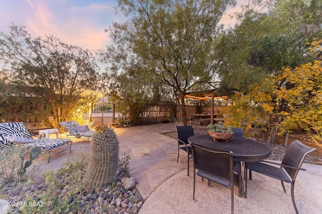 view of patio terrace at dusk