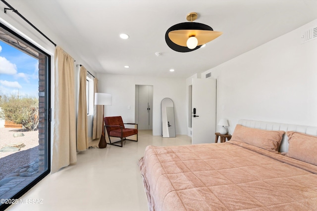 bedroom featuring access to outside and concrete floors