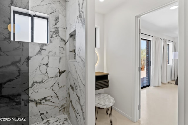 bathroom with tiled shower