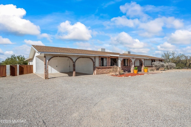 ranch-style home featuring a garage