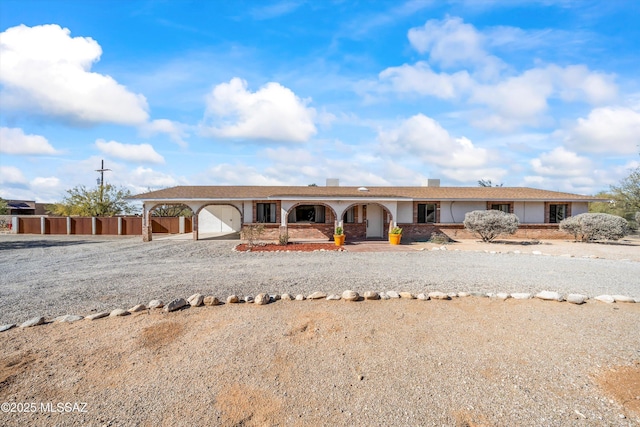 ranch-style house featuring a garage