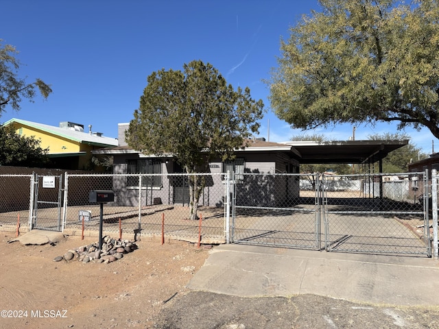 view of front of property featuring a carport