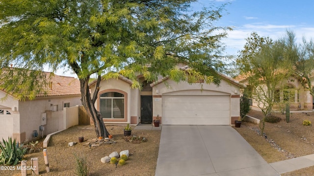 view of front of property featuring a garage