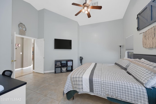 tiled bedroom featuring ceiling fan and high vaulted ceiling