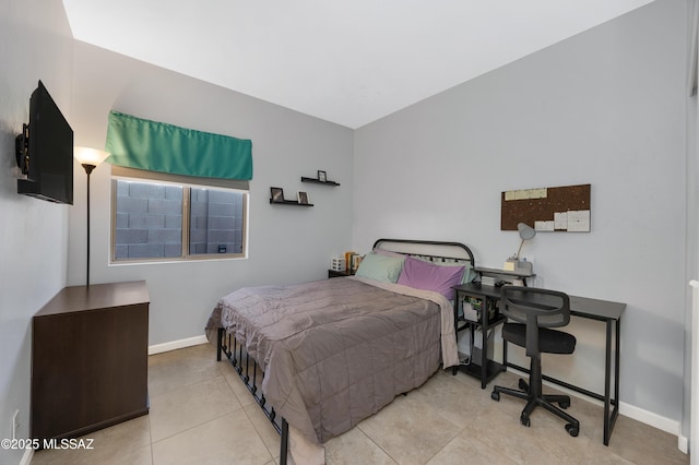 bedroom with light tile patterned floors