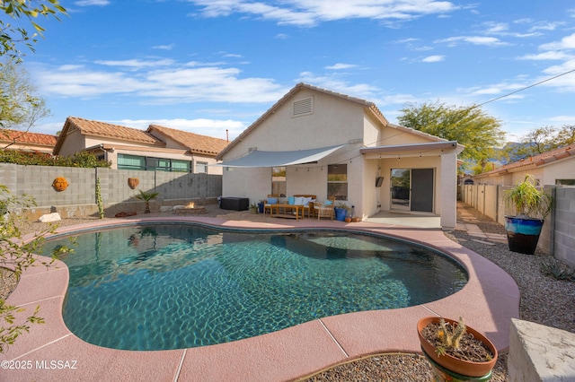 view of pool with an outdoor living space and a patio