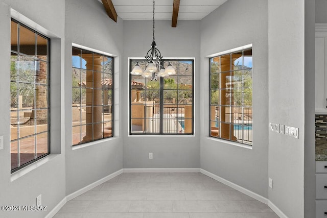 interior space featuring a chandelier, beam ceiling, wood ceiling, and light tile patterned flooring