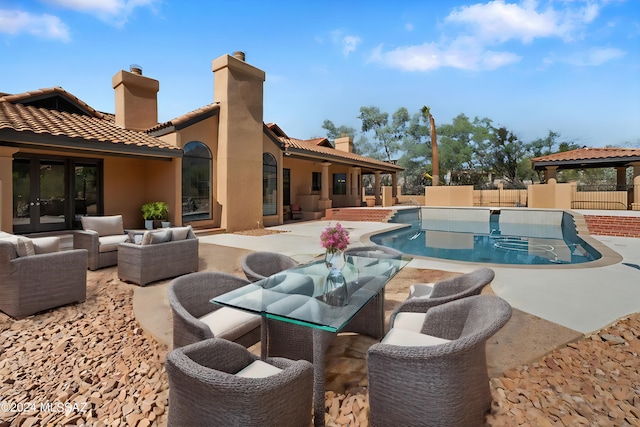 view of pool with outdoor lounge area and a patio area