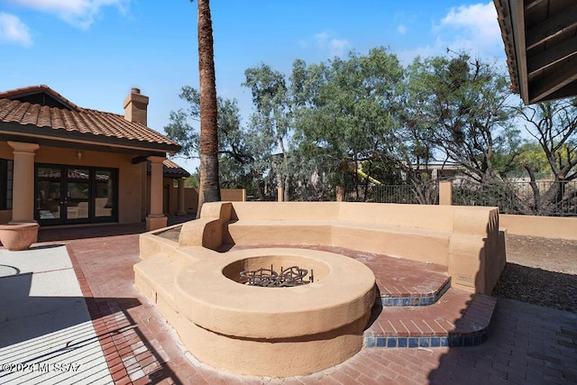 view of patio / terrace with a fire pit