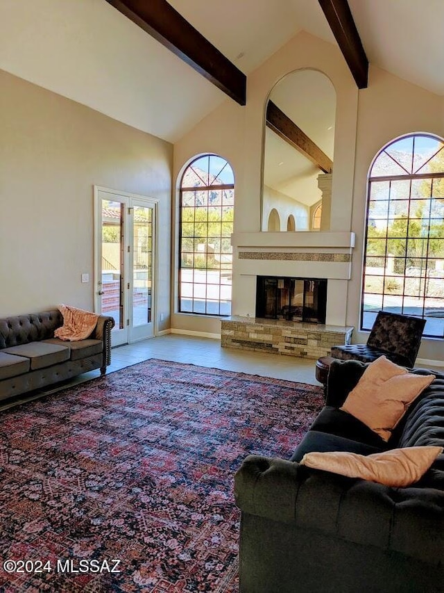 living room featuring beam ceiling and high vaulted ceiling