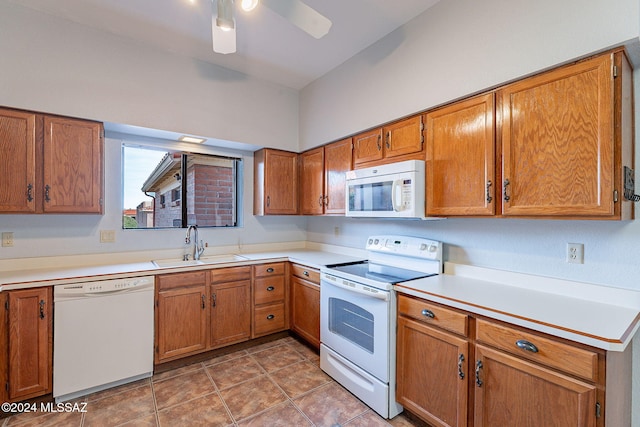 kitchen with ceiling fan, sink, and white appliances