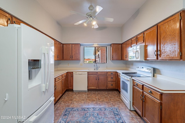 kitchen featuring white appliances, ceiling fan, and sink