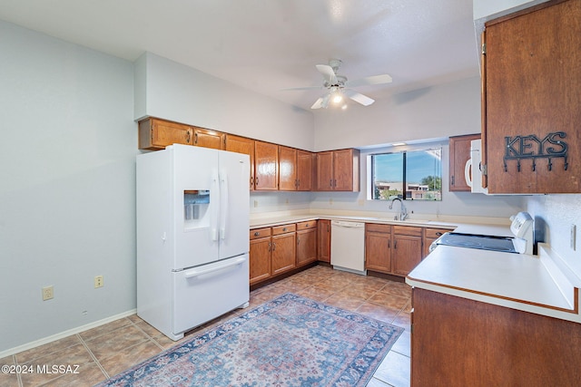 kitchen with ceiling fan, white appliances, sink, and light tile patterned floors