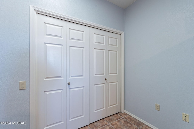 interior space featuring a closet and tile patterned flooring