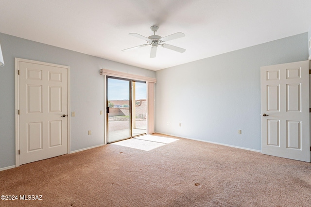 carpeted empty room with ceiling fan