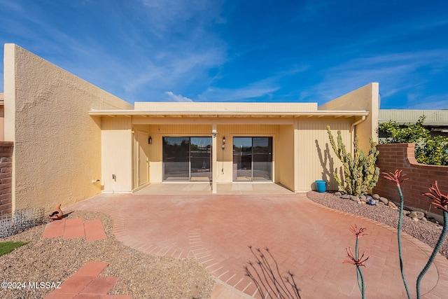 rear view of property with a patio