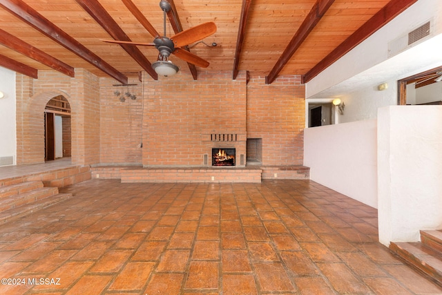 view of patio with ceiling fan and a fireplace