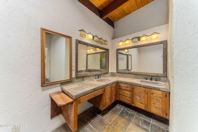 bathroom with beam ceiling, vanity, and wood ceiling