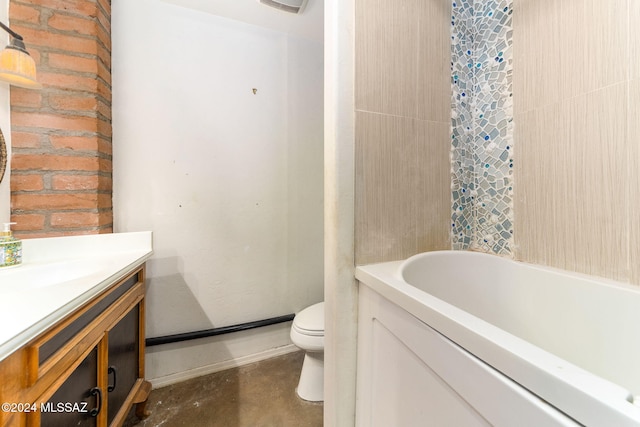 bathroom featuring a washtub, vanity, concrete floors, and toilet