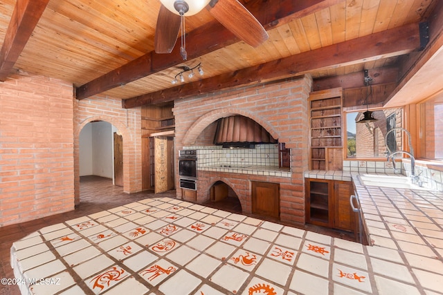 view of patio featuring area for grilling and sink