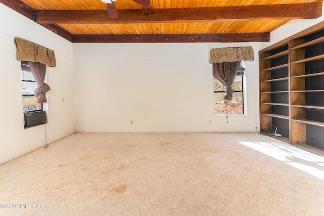 empty room with carpet, a healthy amount of sunlight, and wooden ceiling