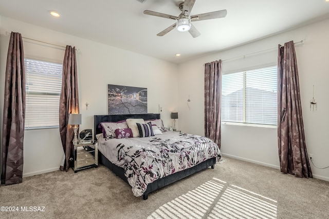 carpeted bedroom featuring ceiling fan