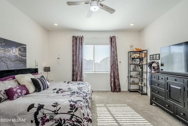 bedroom with light colored carpet and ceiling fan