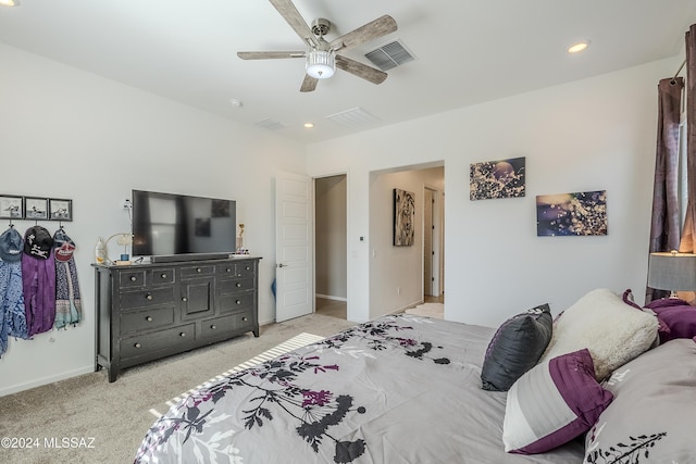 bedroom with ceiling fan and light colored carpet