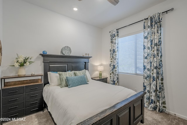 bedroom with light carpet and ceiling fan