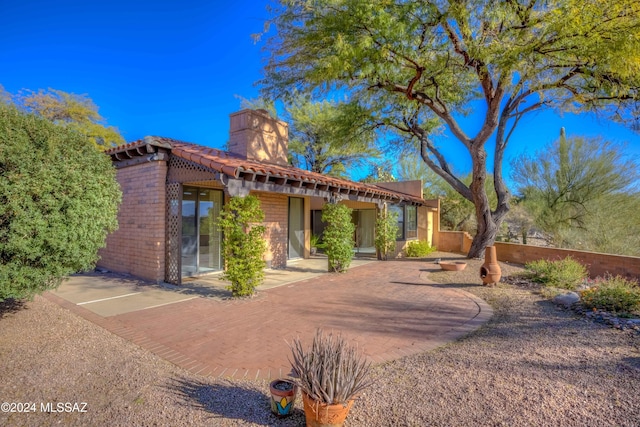 rear view of property with a patio