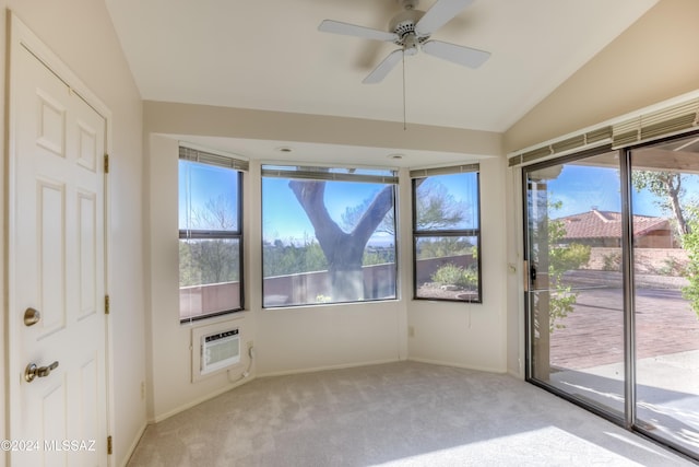 interior space with ceiling fan, lofted ceiling, and a wall unit AC