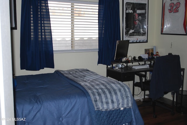 bedroom featuring hardwood / wood-style floors