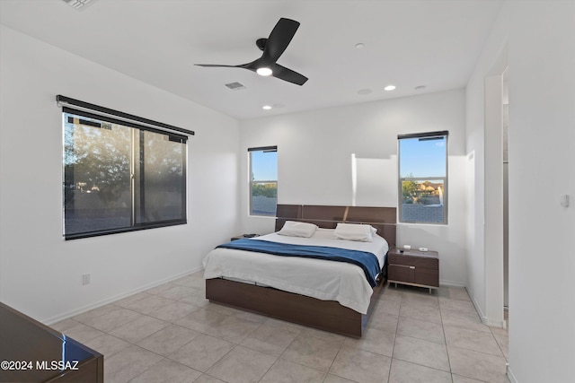 tiled bedroom with ceiling fan