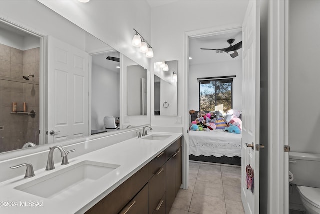 bathroom featuring tile patterned flooring, vanity, and toilet