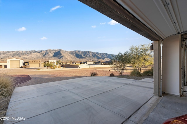 view of patio / terrace featuring a mountain view