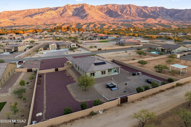 birds eye view of property with a mountain view