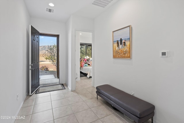 entryway with light tile patterned floors