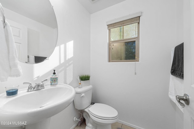 bathroom featuring sink and toilet